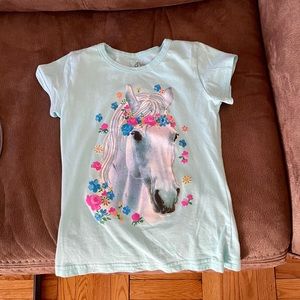 Hardly worn aqua-colored girls’ unicorn t-shirt!